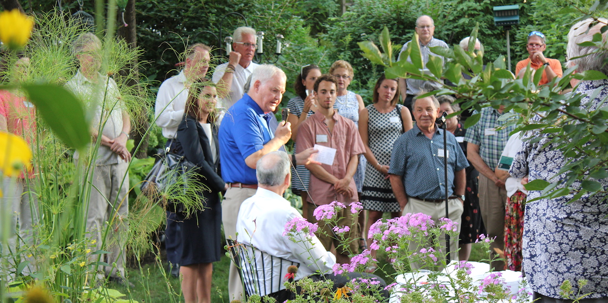 Rep. Carlson speaks at an event with Gov. Dayton